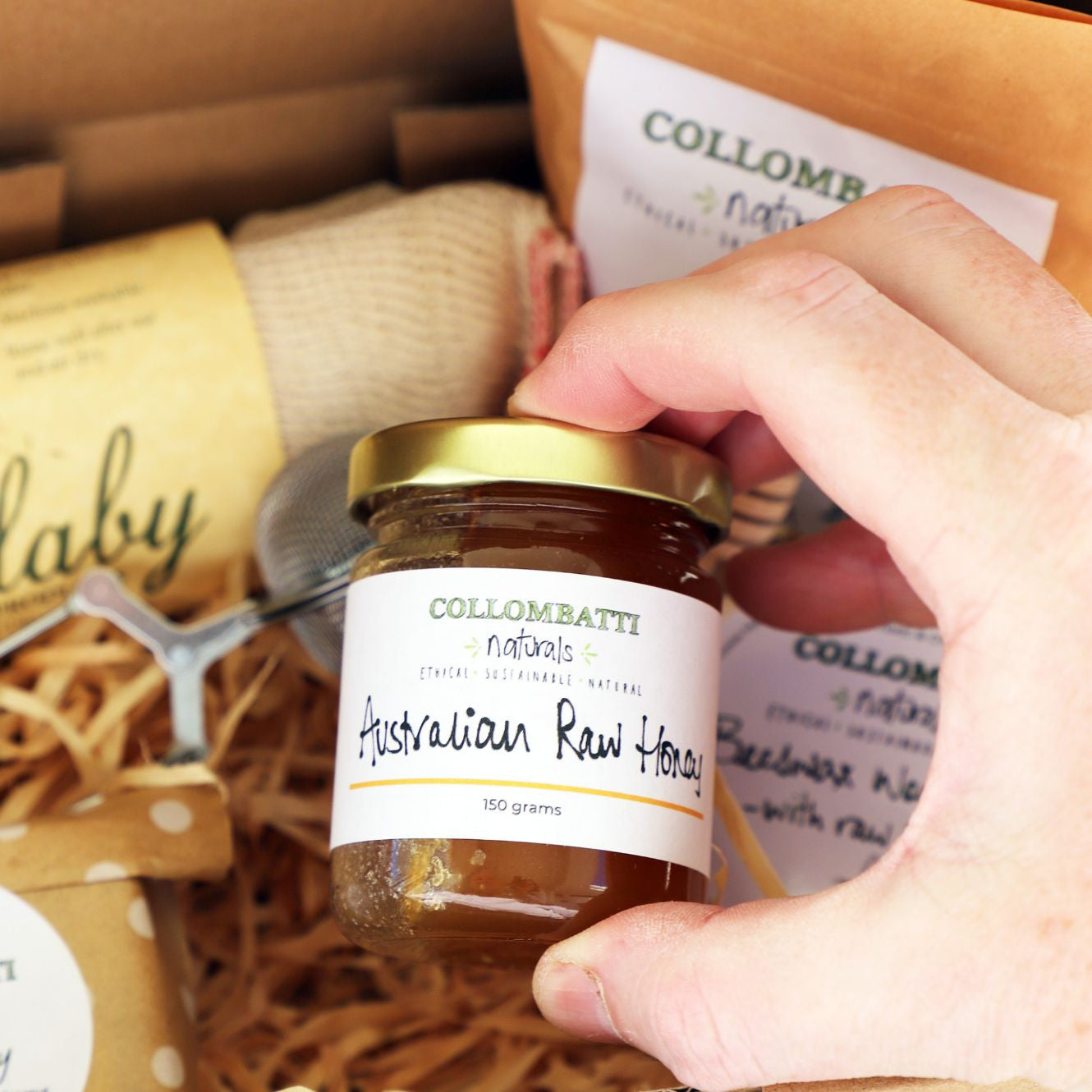 Collombatti Naturals local Australian honey held in a hand
