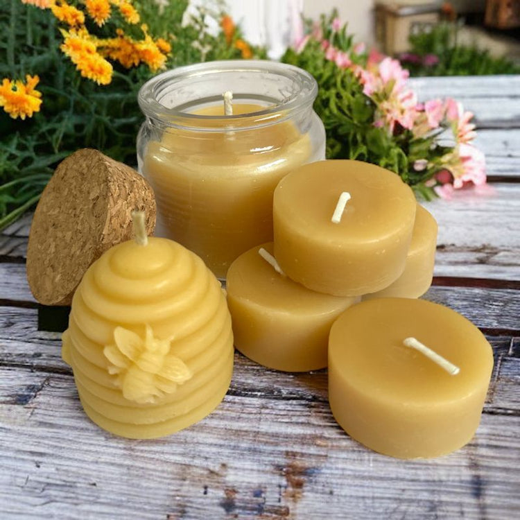 Collombatti Naturals Pure Australian beeswax candles sitting on a timber bench