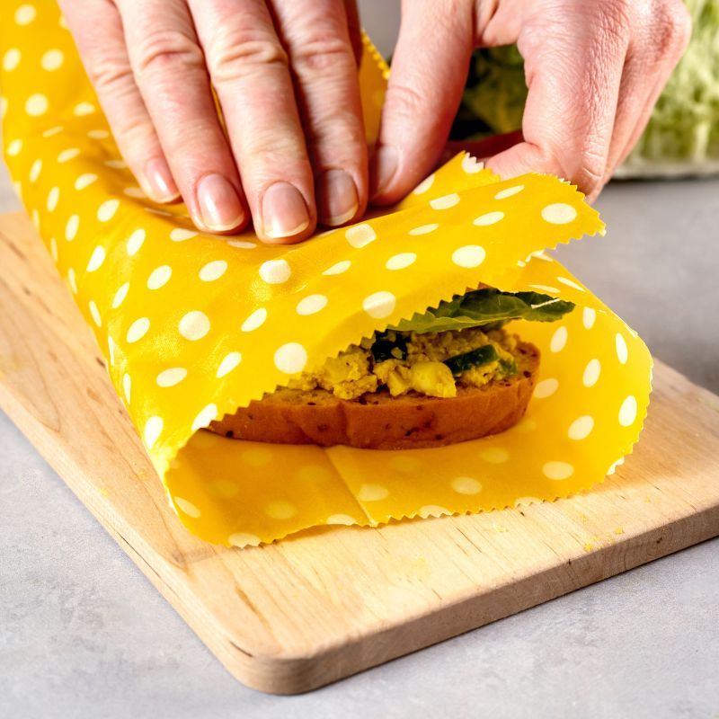 Collombatti Naturals Beeswax Wrap pack being used on a sandwich
