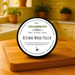 All-natural beeswax and raw linseed oil container sitting on a wooden chopping board in a homely kitchen with green plants in the background