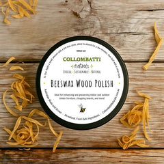 Beeswax wood polish with raw linseed oil 100ml, sitting on a wooden table surrounded by wood shavings