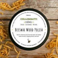 Beeswax wood polish with raw linseed oil 250ml, sitting on a wooden table surrounded by wood shavings