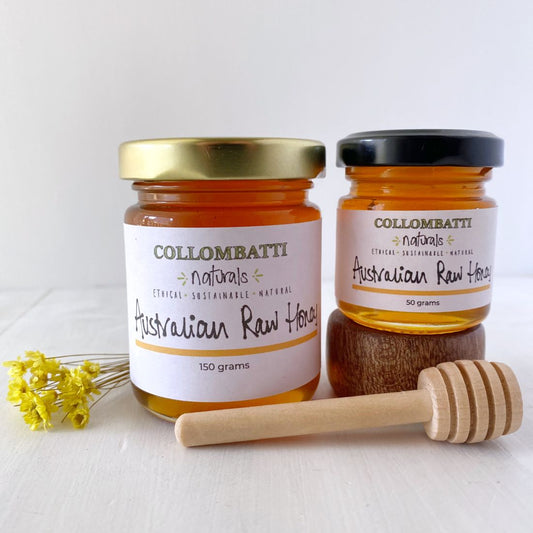 Collombatti Naturals small honey jars with honey swizzle stick and yellow flowers