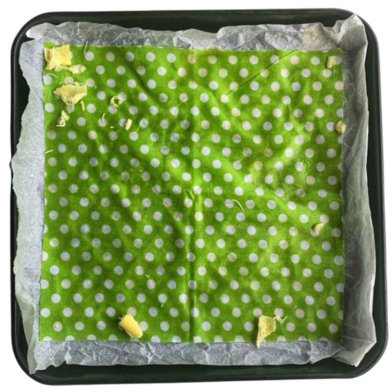 collombatti naturals making beeswax wraps on an oven tray